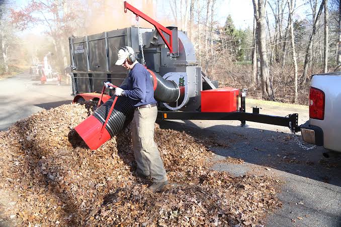 Curbside leaf pickup in a Grand Rapids MI neighborhood by Diversified Tree Service